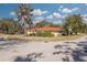 Single-story home with red tile roof, located on a corner lot at 2430 Roberta Ln, Clearwater, FL 33764
