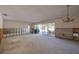 Living room under renovation with pool view at 2430 Roberta Ln, Clearwater, FL 33764