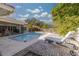 Inviting pool area with lounge chairs and a brick patio at 2430 Roberta Ln, Clearwater, FL 33764