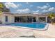 Inviting kidney-shaped pool with patio and screened enclosure at 2430 Roberta Ln, Clearwater, FL 33764