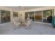 Relaxing screened patio with table and chairs near pool at 2430 Roberta Ln, Clearwater, FL 33764
