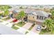 Row of townhomes with palm trees and spacious driveways at 28523 Pleasant Bay Loop, Wesley Chapel, FL 33543