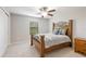Bedroom with wood bed frame and window coverings at 28523 Pleasant Bay Loop, Wesley Chapel, FL 33543