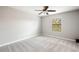 Bright bedroom with window and ceiling fan at 28523 Pleasant Bay Loop, Wesley Chapel, FL 33543