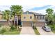 Two-story townhome with two-car garage, landscaped yard, and attractive exterior finishes at 28523 Pleasant Bay Loop, Wesley Chapel, FL 33543