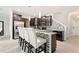 Modern kitchen with dark brown cabinets and granite countertops at 28523 Pleasant Bay Loop, Wesley Chapel, FL 33543