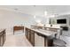 Modern kitchen with granite countertops and stainless steel appliances at 28523 Pleasant Bay Loop, Wesley Chapel, FL 33543