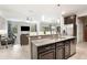Spacious kitchen with island, granite countertops, and stainless steel appliances at 28523 Pleasant Bay Loop, Wesley Chapel, FL 33543