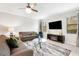 Living room with two sofas, a coffee table and a large TV at 28523 Pleasant Bay Loop, Wesley Chapel, FL 33543