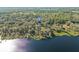 Aerial view showing home's waterfront location and private dock at 31445 Amberlea Rd, Dade City, FL 33523