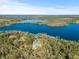 Aerial view of property showcasing expansive lakefront lot at 31445 Amberlea Rd, Dade City, FL 33523