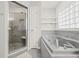 Modern bathroom featuring a large walk-in shower and a relaxing soaking tub at 31445 Amberlea Rd, Dade City, FL 33523