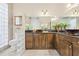 Elegant bathroom with dark wood cabinets and a walk-in shower at 31445 Amberlea Rd, Dade City, FL 33523
