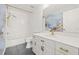 Modern bathroom with white vanity, gold fixtures, and marble-look floors at 31445 Amberlea Rd, Dade City, FL 33523