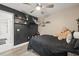 Cozy bedroom with dark walls, ceiling fan, and a TV at 31445 Amberlea Rd, Dade City, FL 33523