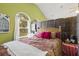 Serene bedroom with wood-look flooring and a room divider at 31445 Amberlea Rd, Dade City, FL 33523