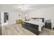 Spacious bedroom with a large bed and hardwood floors at 31445 Amberlea Rd, Dade City, FL 33523