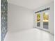 Bonus room with white floor and french doors leading outside at 31445 Amberlea Rd, Dade City, FL 33523
