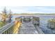 Wooden dock with picnic table overlooking the lake at 31445 Amberlea Rd, Dade City, FL 33523