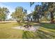 Fire pit area with gravel base, perfect for outdoor gatherings at 31445 Amberlea Rd, Dade City, FL 33523