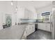Modern kitchen with white cabinets and granite countertops at 31445 Amberlea Rd, Dade City, FL 33523