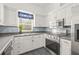Modern kitchen with white cabinets and granite countertops at 31445 Amberlea Rd, Dade City, FL 33523