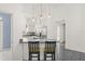 Modern kitchen with white cabinets and granite countertops at 31445 Amberlea Rd, Dade City, FL 33523