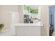 Modern white kitchen with black appliances at 31445 Amberlea Rd, Dade City, FL 33523