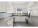 Modern kitchen with white cabinets and granite countertops at 31445 Amberlea Rd, Dade City, FL 33523