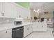 Bright kitchen with white cabinets, quartz countertops, and stainless steel appliances at 31445 Amberlea Rd, Dade City, FL 33523