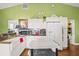 Charming kitchen with white cabinets and a farmhouse sink at 31445 Amberlea Rd, Dade City, FL 33523