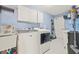 Bright laundry room with washer, dryer, and utility sink at 31445 Amberlea Rd, Dade City, FL 33523