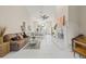 Open living room showcasing a comfortable couch and tile floors at 31445 Amberlea Rd, Dade City, FL 33523