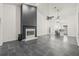 Open floor plan living area with fireplace, high ceilings, and view into the kitchen at 31445 Amberlea Rd, Dade City, FL 33523