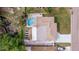 Aerial view showcasing home, pool, and canal-side location at 3282 Honeysuckle Rd, Largo, FL 33770
