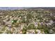 Aerial view showcasing the home's setting in a quiet neighborhood by the water at 3282 Honeysuckle Rd, Largo, FL 33770