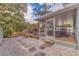 Backyard with grilling station and steps leading to the screened patio at 3282 Honeysuckle Rd, Largo, FL 33770