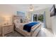 Bedroom with sliding door access to the pool area at 3282 Honeysuckle Rd, Largo, FL 33770