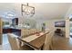 Dining area features a farmhouse table and is open to the kitchen at 3282 Honeysuckle Rd, Largo, FL 33770