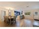 Bright dining room with a rustic farmhouse table and seating for eight at 3282 Honeysuckle Rd, Largo, FL 33770
