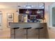 Modern kitchen with dark wood cabinets, granite counters, and stainless steel appliances at 3282 Honeysuckle Rd, Largo, FL 33770