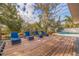 Relaxing pool deck with lounge chairs, offering ample space for entertaining at 3282 Honeysuckle Rd, Largo, FL 33770