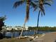 Peaceful waterfront lot with mature palm trees at 330 90Th Ne Ave, St Petersburg, FL 33702