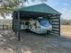 Metal RV cover provides ample parking space at 33830 Sickler Dr, Dade City, FL 33523