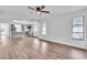 Open living area with new flooring and a view into the updated kitchen at 3721 9Th S Ave, St Petersburg, FL 33711