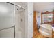 Shower, garden tub, and floral wallpaper at 37538 New Horizons Blvd, Zephyrhills, FL 33541
