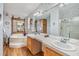 Double vanity, garden tub, and separate shower at 37538 New Horizons Blvd, Zephyrhills, FL 33541
