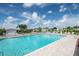 Inviting community pool with lounge chairs at 37538 New Horizons Blvd, Zephyrhills, FL 33541
