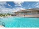 Inviting community pool with lounge chairs at 37538 New Horizons Blvd, Zephyrhills, FL 33541