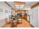 Eat-in kitchen with light wood cabinets and glass table at 37538 New Horizons Blvd, Zephyrhills, FL 33541